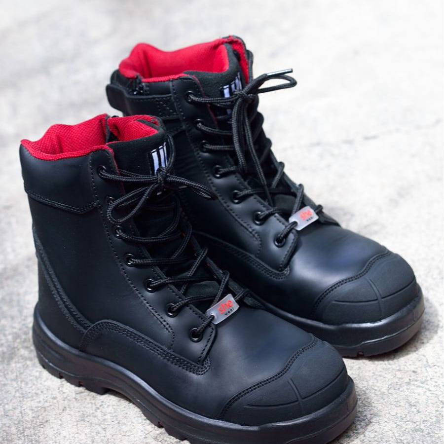 Black lace-up composite boots with red interior lining.