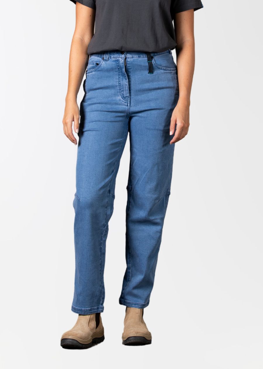 A woman wearing a pair of blue jeans with elastic waistband and multiple pockets