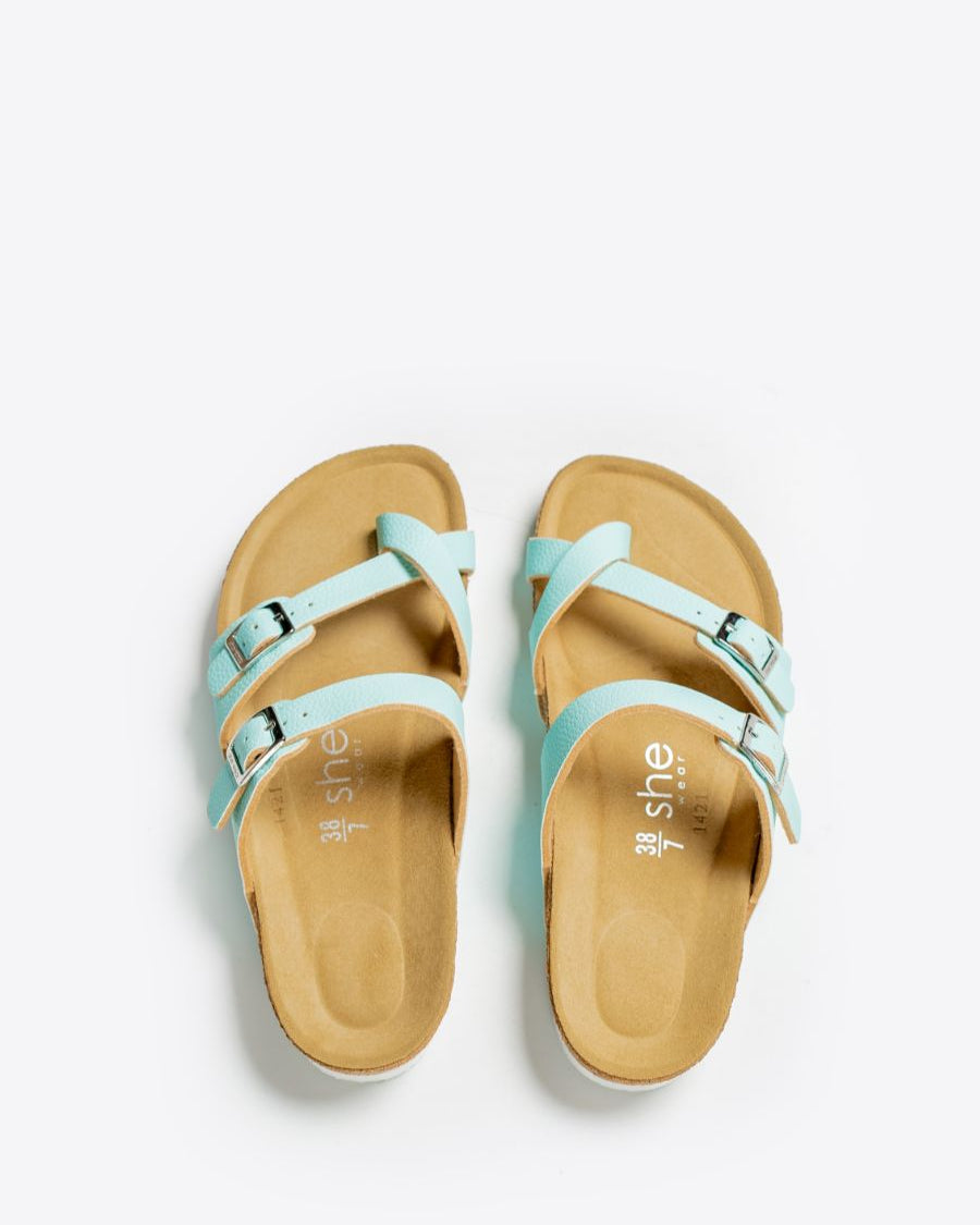 A pair of sandals with three leather straps