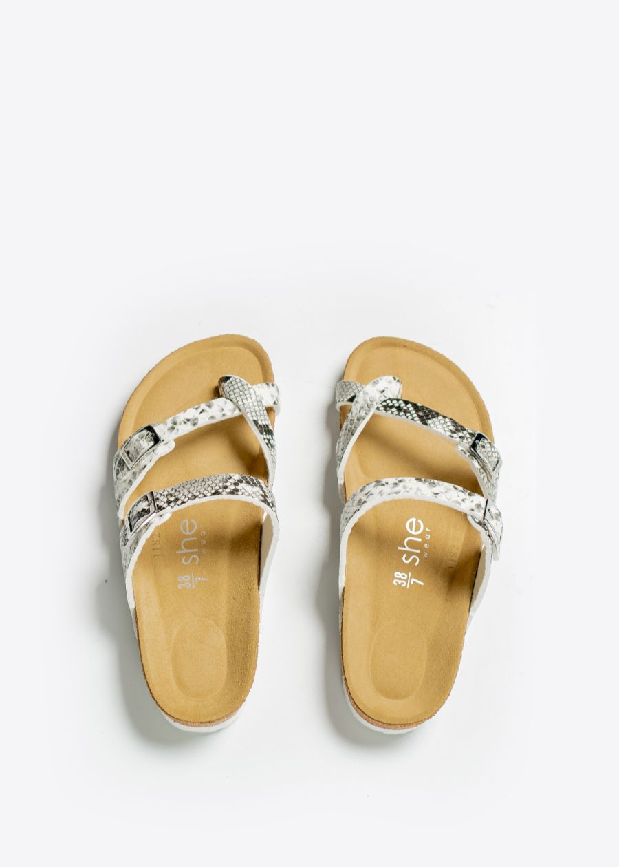 A pair of slides with Fabric & PU straps with adjustable metal buckle printed with snakeskin pattern