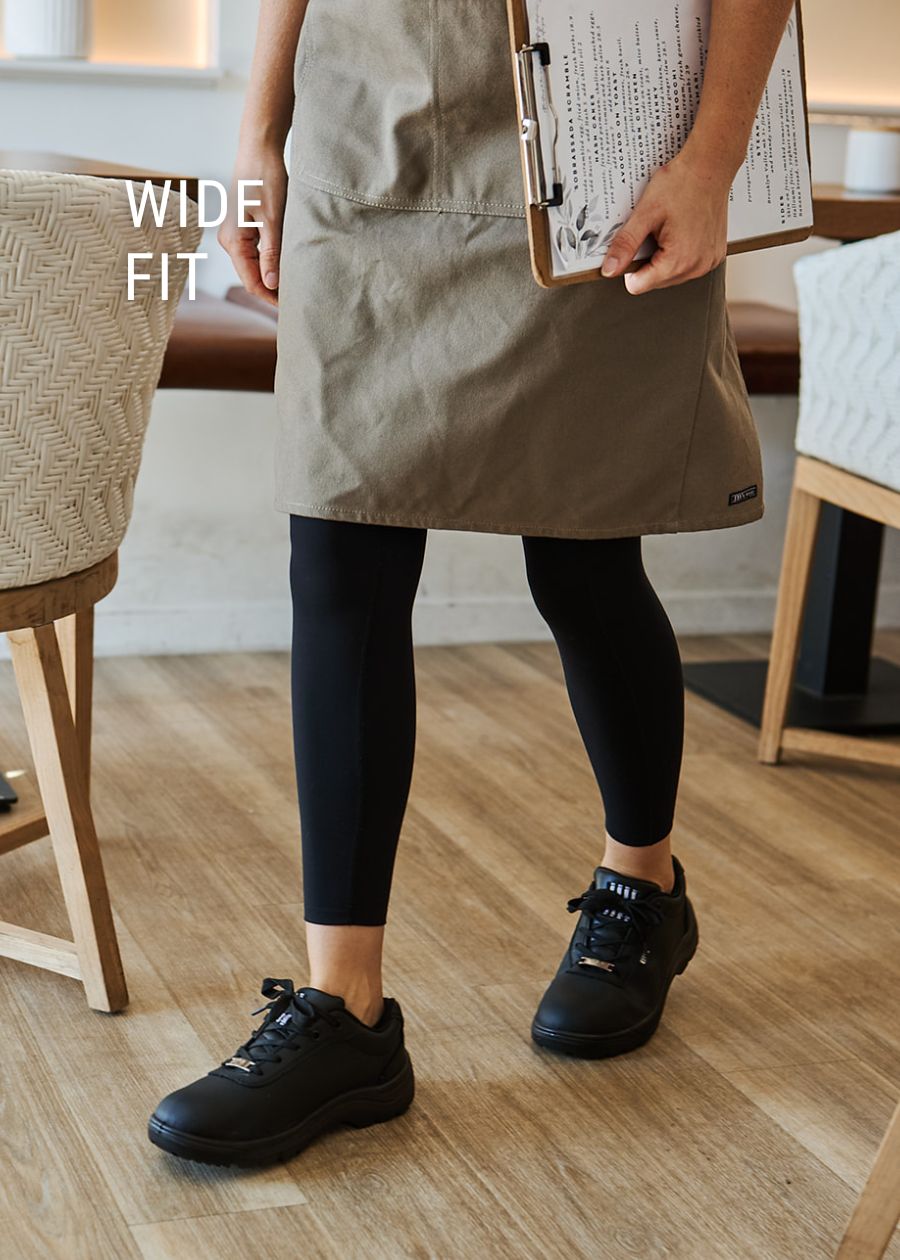nurtures wide fit sneakers for women in black hospitality workers