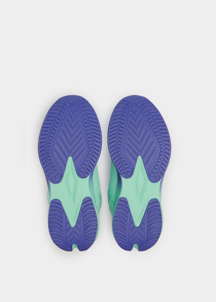 View of purple and aqua slip resistant rubber outsole