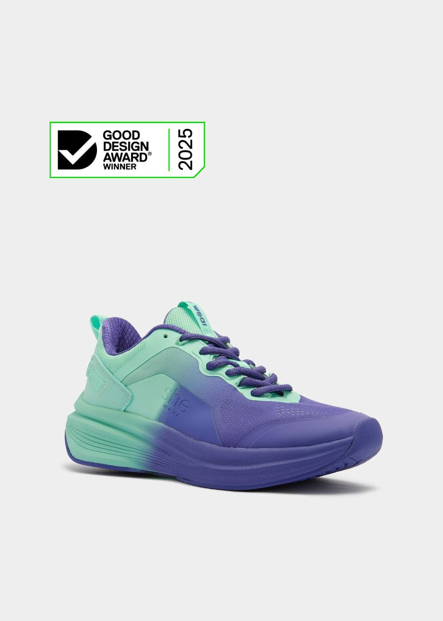 Purple and Aqua walking shoes with 2025 Good Design Award Winner badge.