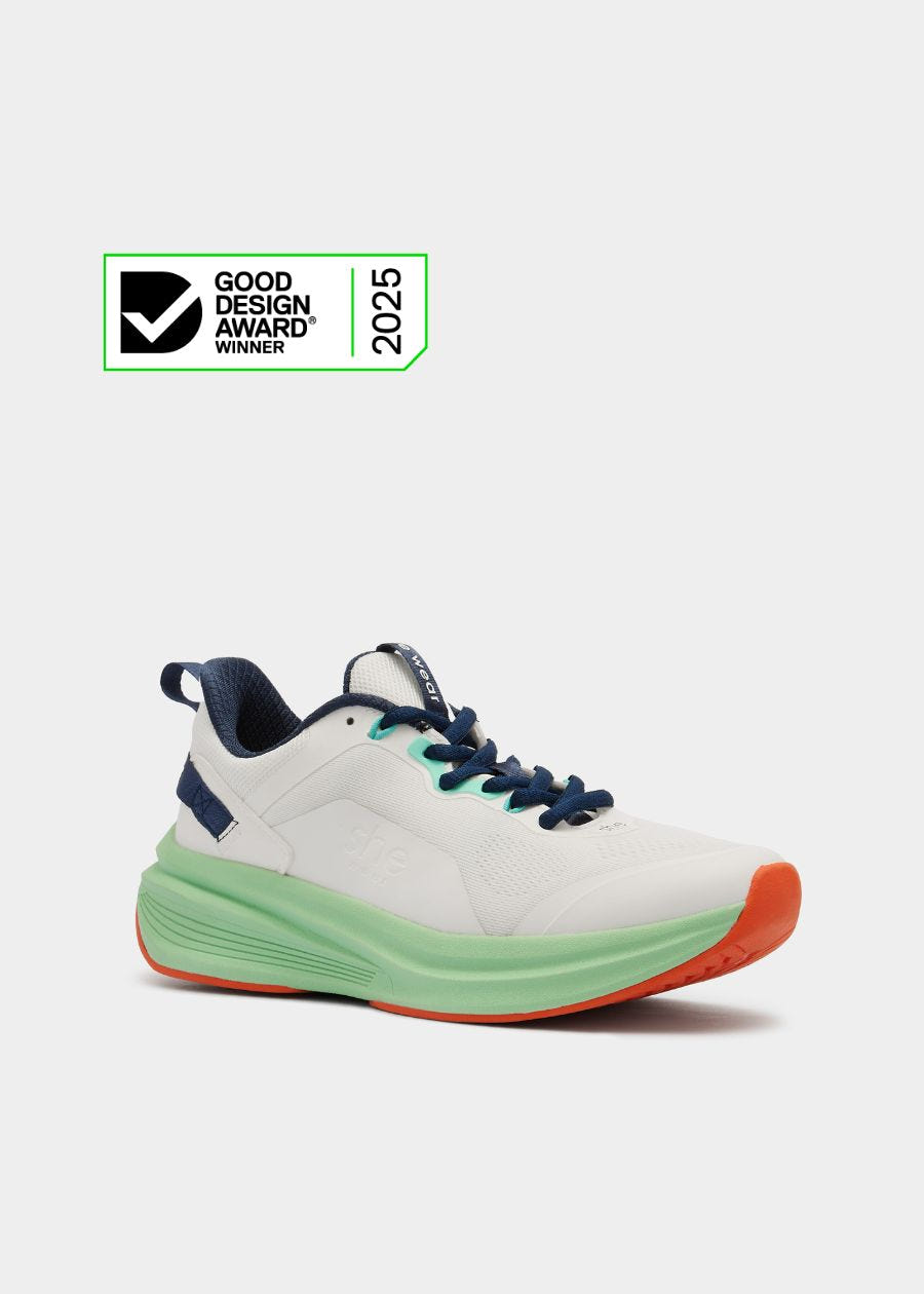 White, Navy, Green, and Orange walking shoes with 2025 Good Design Award Winner badge.