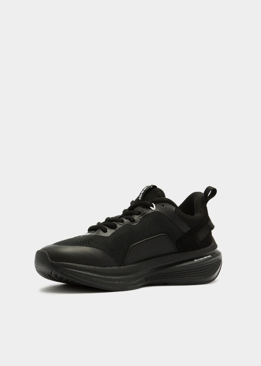 Black walking sneaker side view of rocker sole