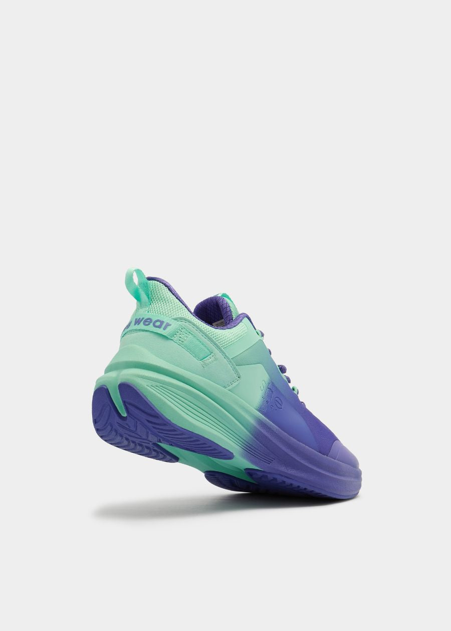 tilted view showing slip resistant rubber rocker sole with mint to purple gradient