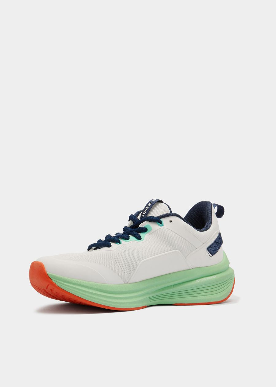 side profile of a white green and navy walking sneaker