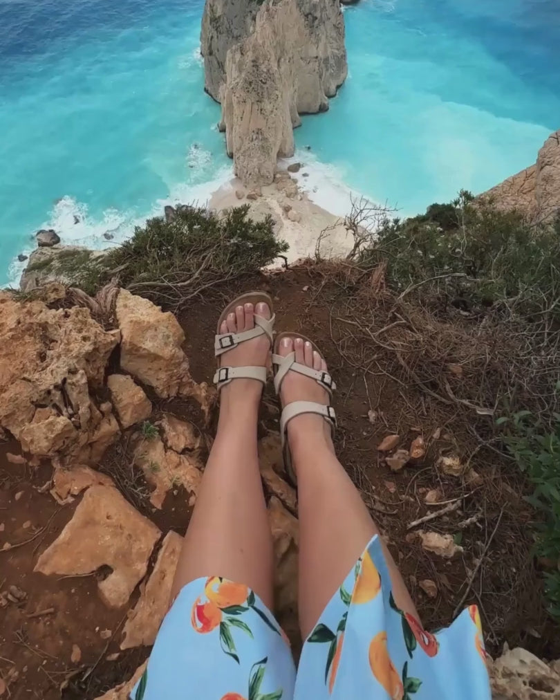 Woman traveling Europe in comfortable beige slides