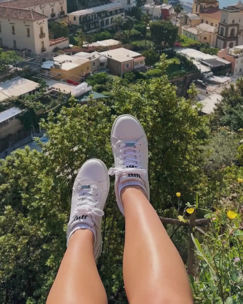 white sneakers that are perfect for travelling