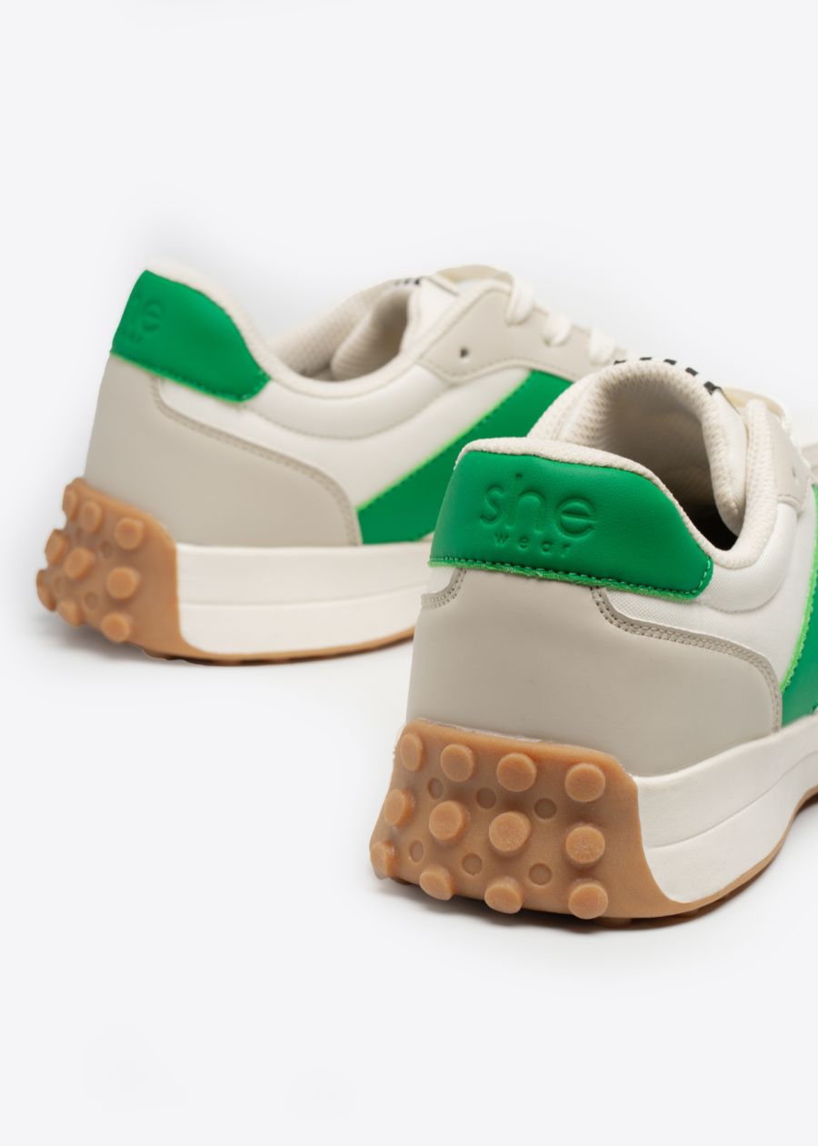 Colourful details on the padded heel counter of a pair of comfortable women's shoes