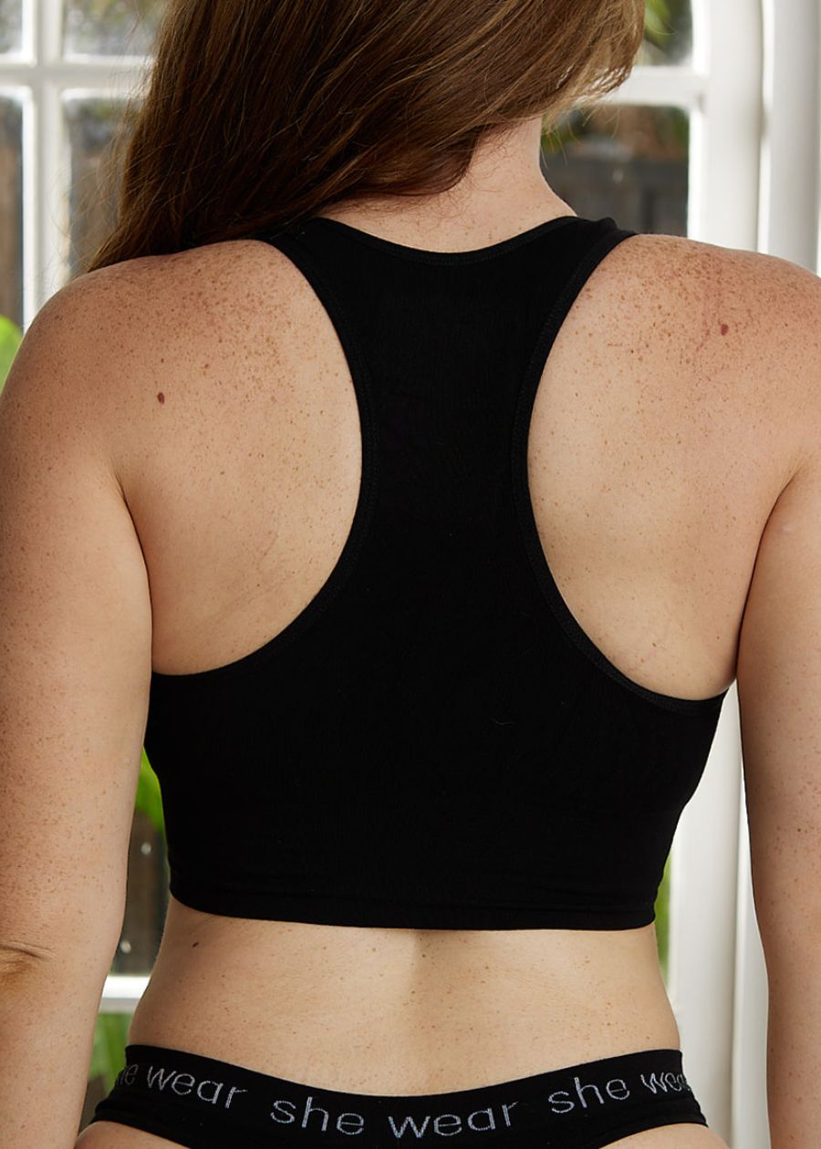 Rear view of woman in a black racerback crop top bra and G-string made of stretchy organic bamboo by an Australian company.