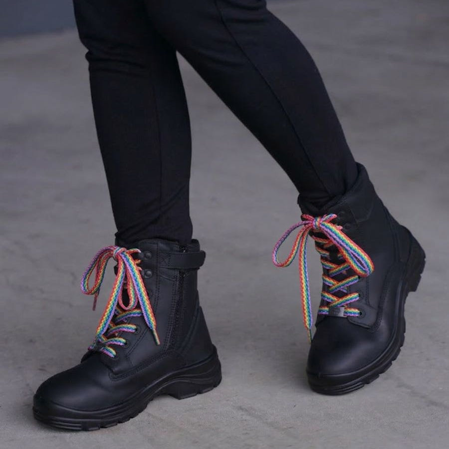 Rainbow boot laces on black zip-up boots.