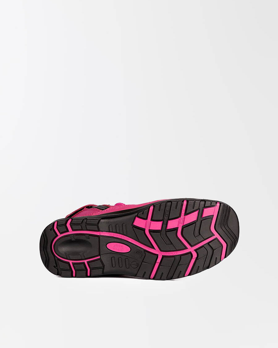 Underneath a safety boot. The black and pink outsole shows heavy duty tread and slip-resistance