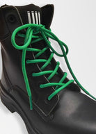 green shoe laces on black boots