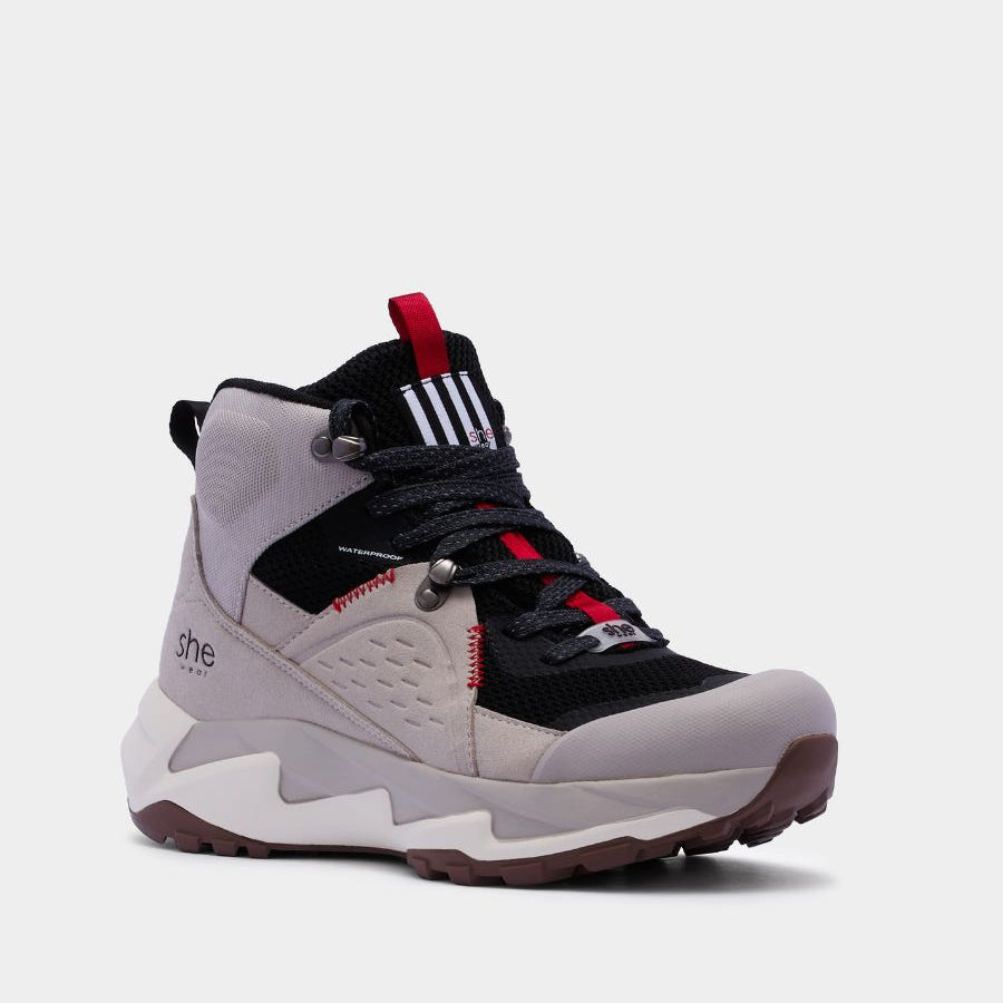 Vegan friendly, flyknit and microfibre hiking boot in black and grey. Featuring red accents.