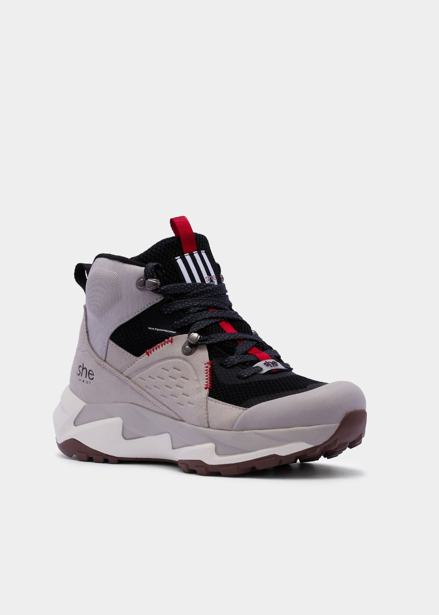 Vegan friendly, flyknit and microfibre hiking boot in black and grey. Featuring red accents.