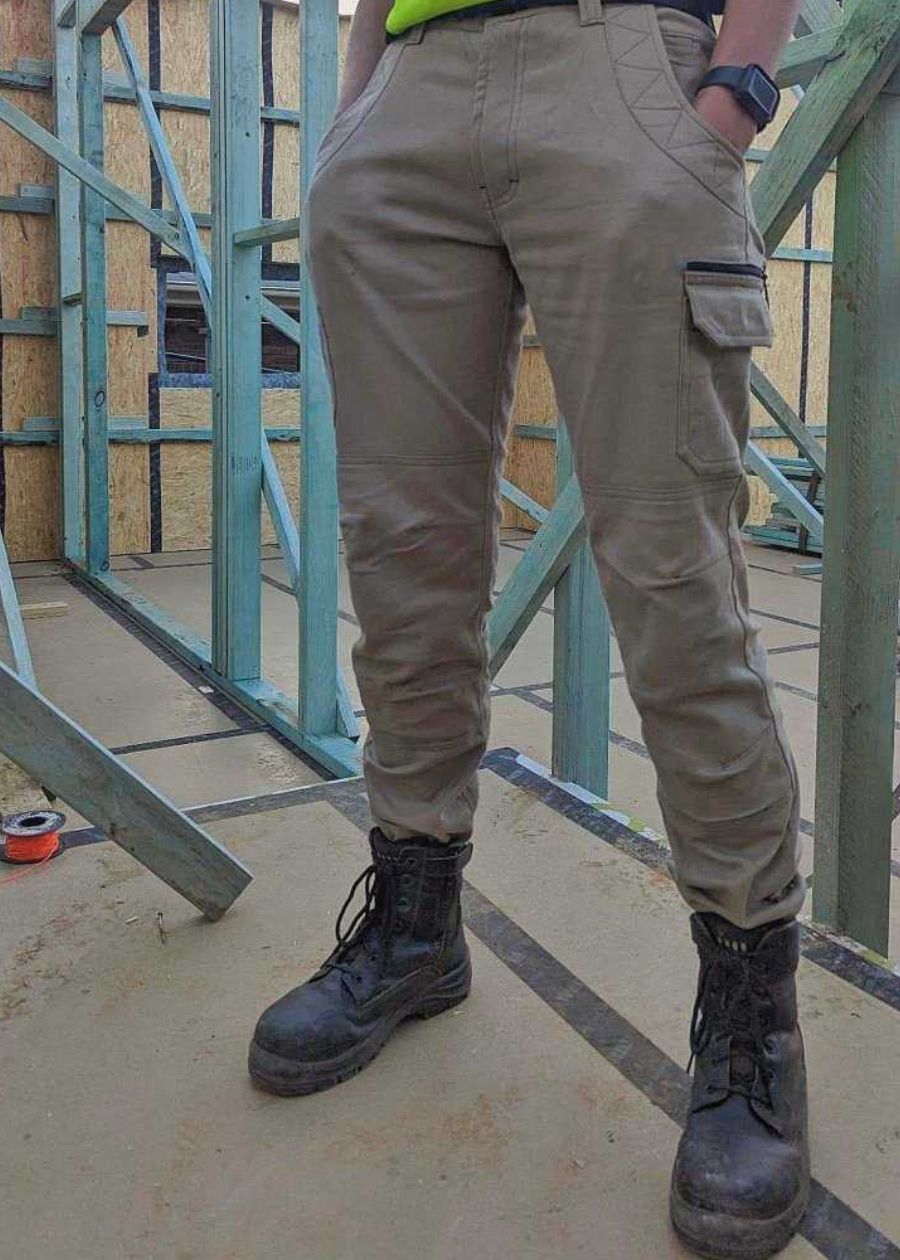 woman in black vegan work boots on a building site