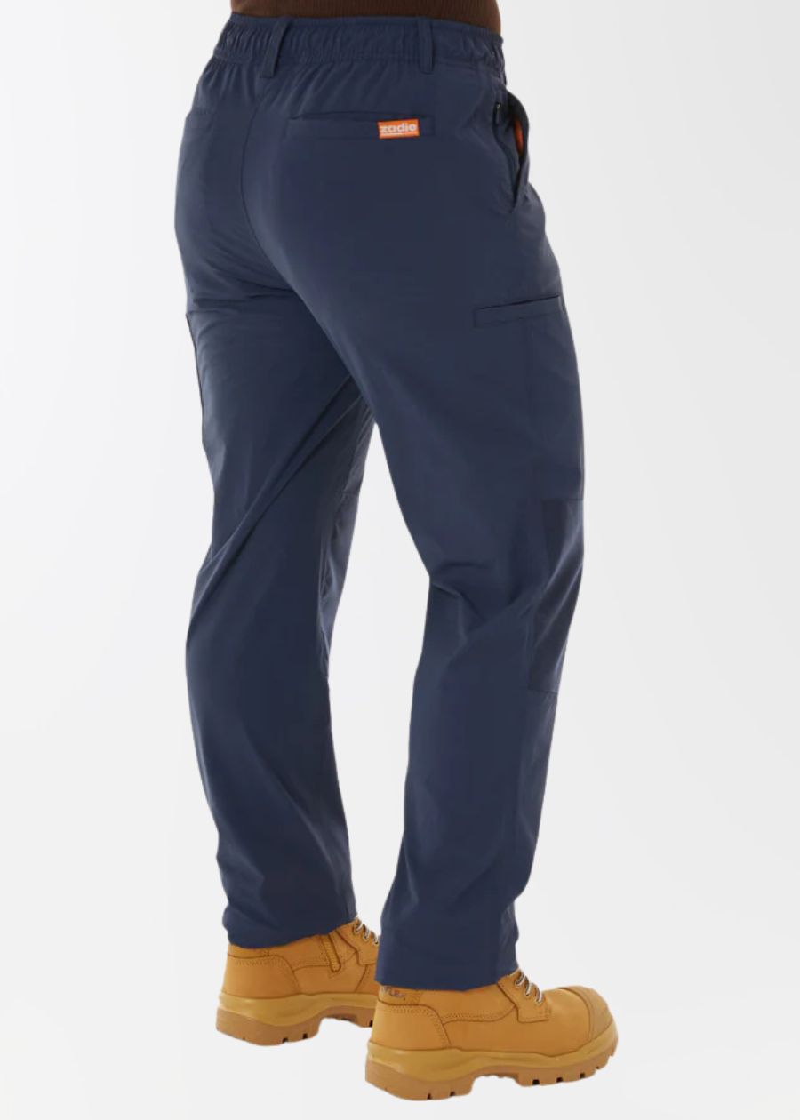 Rear view of a woman wearing navy work pants, showing straight leg cut and abundant pockets