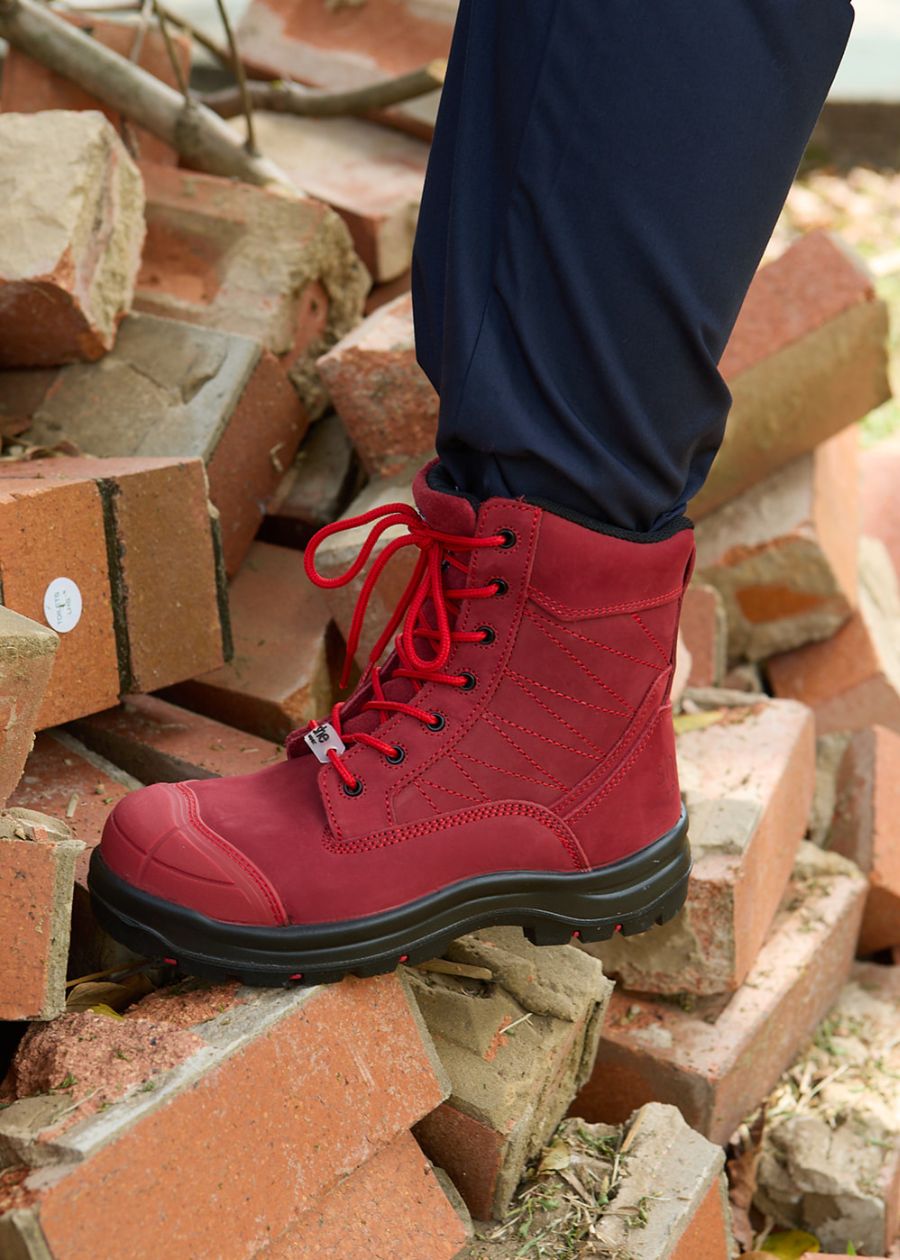 Limited edition red lace-up safety boots with a black sole. 