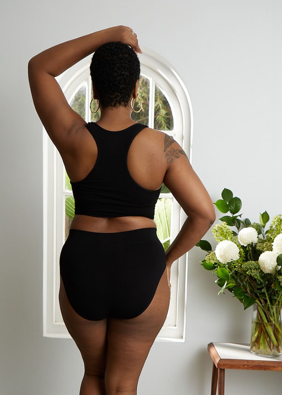 rear view of a woman wearing comfortable black bamboo briefs