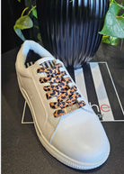 white sneakers with leopard print shoe laces