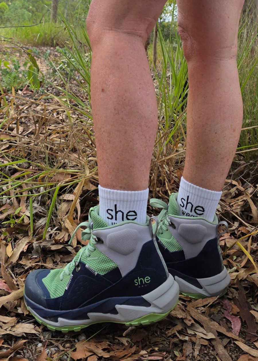 women hiking in scrub in she wear trek boots