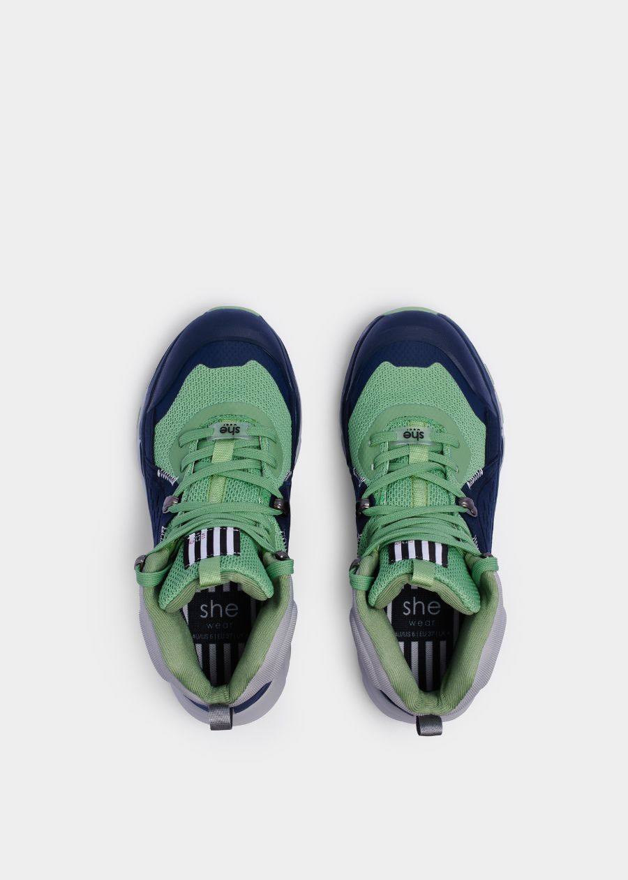 Birds eye view of padded collar and heel on green and navy hiking boots with green laces. 