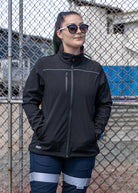 Bisley women's soft shell jacket black on model in a industrial site